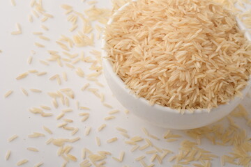 Pile of brown rice isolated on white background.