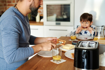 Close up of father and son having breakfast together