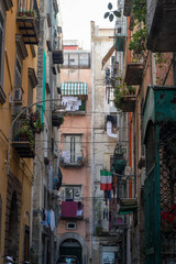 Fototapeta na wymiar Vico II Foglie a Santa Chiara, a narrow street in Naples, Italy