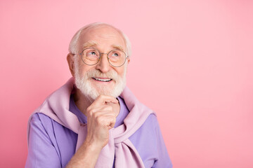 Photo portrait of dreamy pensioner looking empty space touching chin smiling isolated on pastel...