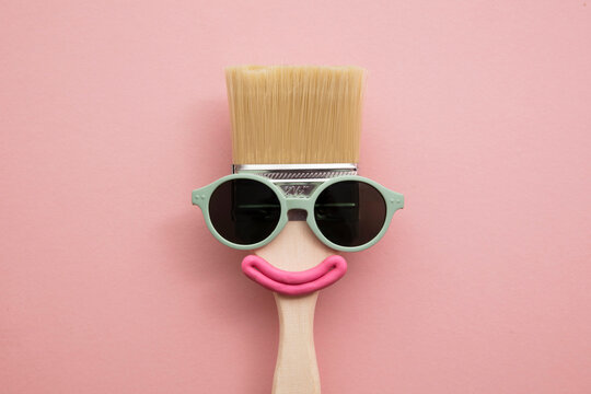 Paint brush diy character with sunglasses and smile