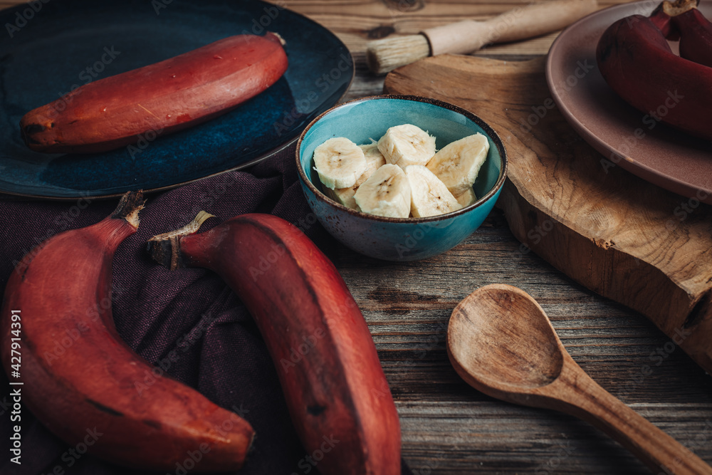 Wall mural fresh raw red bananas from south america