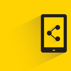 smartphone and share with shadow on yellow background