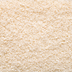 Raw white rice grain food background. Healthy eating. Top view.