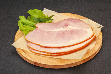 Sliced pork belly over board