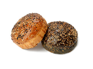 two baked sesame seed buns isolated on white background