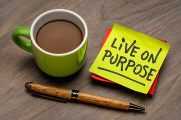 Live on purpose inspirational note - handwriting on a sticky note with a cup of coffee, personal development, goals and lifestyle concept