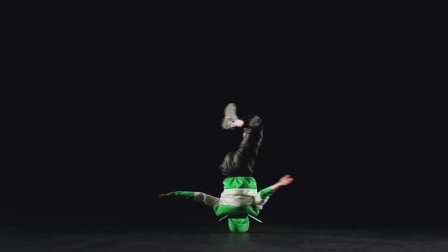 B-Girl spinning on head. Slow motion