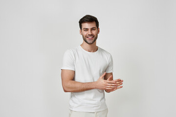 Handsome bearded man dressed in white t-shirt