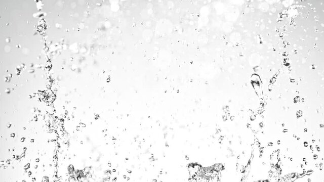 Super Slow Motion Shot of Water Splash on Light Grey Background at 1000fps.
