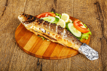 Grilled sea bass served vegetables