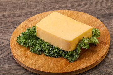 Tasty yelloow Tilsiter cheese brick