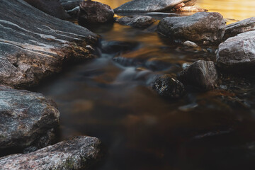 Fototapeta na wymiar water flowing over rocks