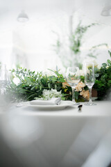 glass glasses on the table. holiday. In the foreground is a chair