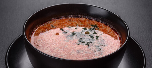 Tasty fresh spicy Malaysia soup tom yam with tomato