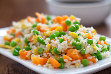 Oriental cantonese rice. Basmati rice with green peas, eggs and carrots.