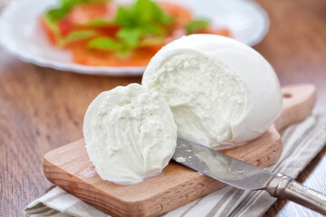 Buffalo Mozzarella, Italian cheese on wooden board.