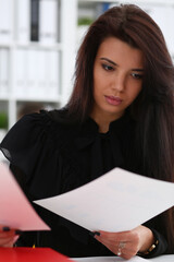 Beautiful smiling brunette woman sit at table