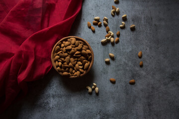 View from top of almonds in a bowl  on a background