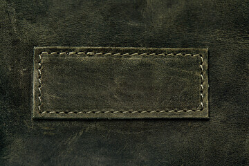 Elegant dark olive leatherette background. Leather texture. Free space for text.