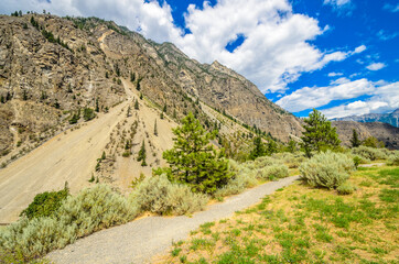 Beautiful landscape of valley in Alpine mountains, small trail, hike root, majestic picturesque view in sunny day. Lillooet Setaon Lake. Vancouver. British Columbia. Canada.