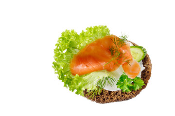 Traditional scandinavian open toast with cheese cream, smoked salted salmon, lettuce, cucumber and herbs.