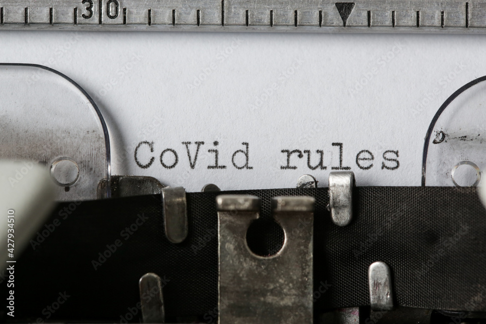 Fototapete covid rules text on blank paper typed on a retro typewriter
