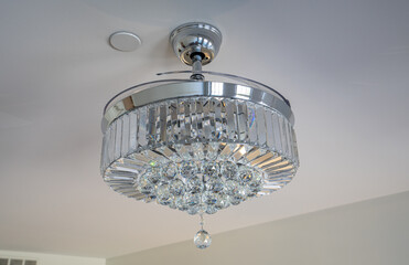 modern style glass chadelier is hanging above you on display