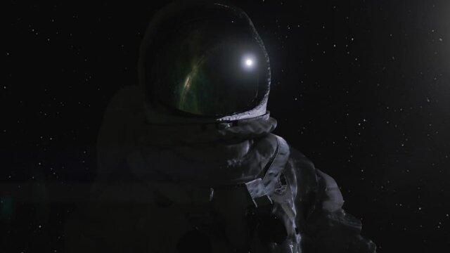 Astronaut in space suit close up with stars in the background.