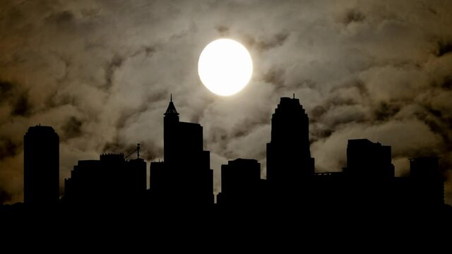 Raleigh Skyline with Fog, Smoke and Dark Atmosphere, Time Lapse by Night with Full Moon, North Carolina, USA