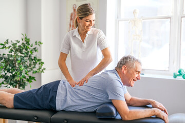 Obraz premium A Modern rehabilitation physiotherapy worker with senior client