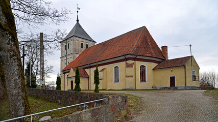 Fototapeta premium Built in the Gothic style in 1719, now the Catholic Church of Our Lady of Rosary in Szarejki in Masuria, Poland. The photos show a general view of the temple.