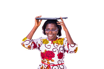 close up of a woman carrying a laptop computer, smiling