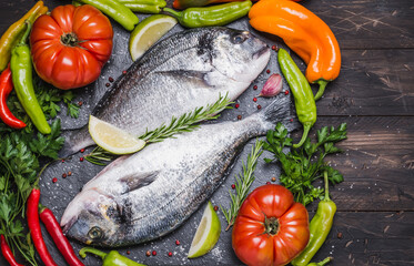 Fish with vegetables cooking background, dorado fish copy space.