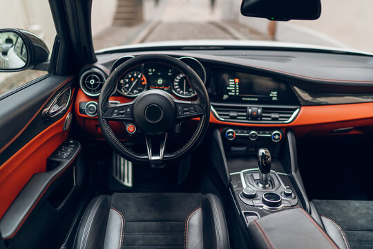 Modern car interior with leather panel, sport seats, multimedia and digital dashboard - Powered by Adobe