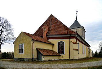Fototapeta na wymiar Built in the Gothic style in 1719, now the Catholic Church of Our Lady of Rosary in Szarejki in Masuria, Poland. The photos show a general view of the temple.