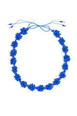 Fototapeta premium Vertical closeup of stylish upcycled blue necklace made out of post-consumer waste, isolated on a white background. Creative reuse of waste, ideal gift for her.