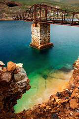 Greece, Serifos island, Mega Livadi village. An old, abandoned "brigde" or "ladder" used for loading minerals to ships.