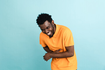 African man's portrait isolated over blue studio background with copyspace