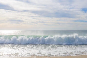 Set of pictures of a fantastic ocean wave in different stages. Cloudy sunrise sky. San Jose del Cabo. Mexico.