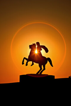 Silhouette of the statue of Alexander the Great (ancient king of Macedonia) riding his horse, Bucephalus. Located at the area of Nea Paralia, Thessaloniki, Macedonia, Greece.