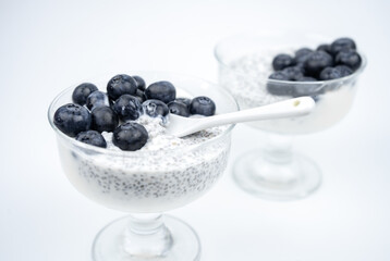 Healthy breakfast with yogurt, chia seeds and blueberry. Vegan food