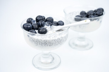 Healthy breakfast with yogurt, chia seeds and blueberry. Vegan food