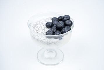 Healthy breakfast with yogurt, chia seeds and blueberry. Vegan food
