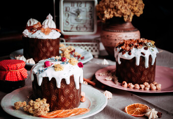 Easter cakes. Panettone. Traditional Easter cake with orange, candied fruit, raisins and cinnamon on a rustic background. Close-up