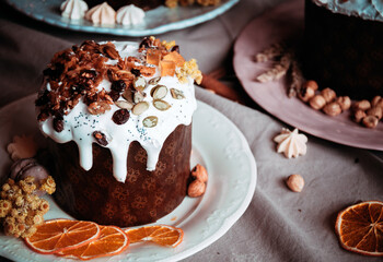 Easter cakes. Panettone. Traditional Easter cake with orange, candied fruit, raisins and cinnamon on a rustic background. Close-up