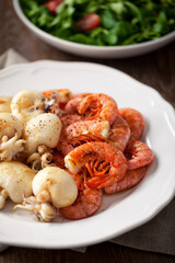 Grilled prawns and cuttlefish on a plate. High quality photo.
