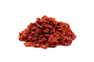 A slide of dried tomatoes, cut in half. Yellow seeds are visible
