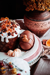 Easter cakes. Panettone. Traditional Easter cake with orange, candied fruit, raisins and cinnamon on a rustic background. Close-up