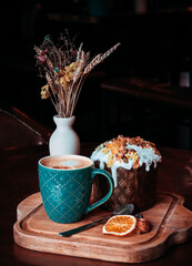 Easter cakes. Panettone. Traditional Easter cake with orange, candied fruit, raisins and cinnamon on a rustic background. Close-up